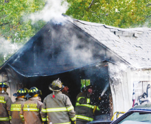Fire totals garage in Harvard