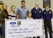 Friesen Ford presented a check for $7,000 to Sutton High School for use by the Sutton FFA Chapter Monday night during the 2014 Fall Chapter banquet. Pictured from the left, Crystal, Adilynn, Jason and Jaydn Friesen present the check to Chapter President Jered Lemkau and Chapter Sentinal Tyler Bailey, representing the Sutton FFA Chapter.